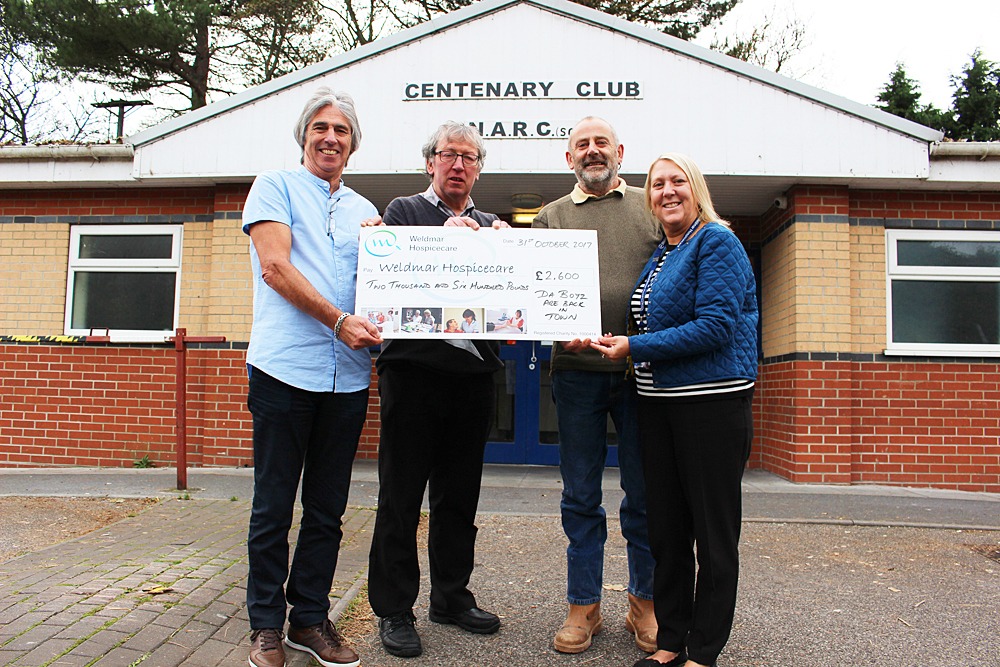Chris Dean, Paul Ward and Simon Brakespear present a cheque for £2,600 to Diane Bentley
