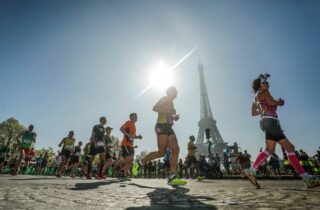 Take on a Challenge Paris Marathon people running past Eiffel Tower