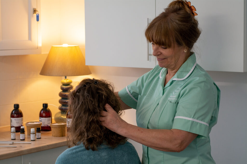 complementary therapy nurse helping patient