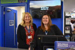 Portland Shop Reopens, staff members at the till