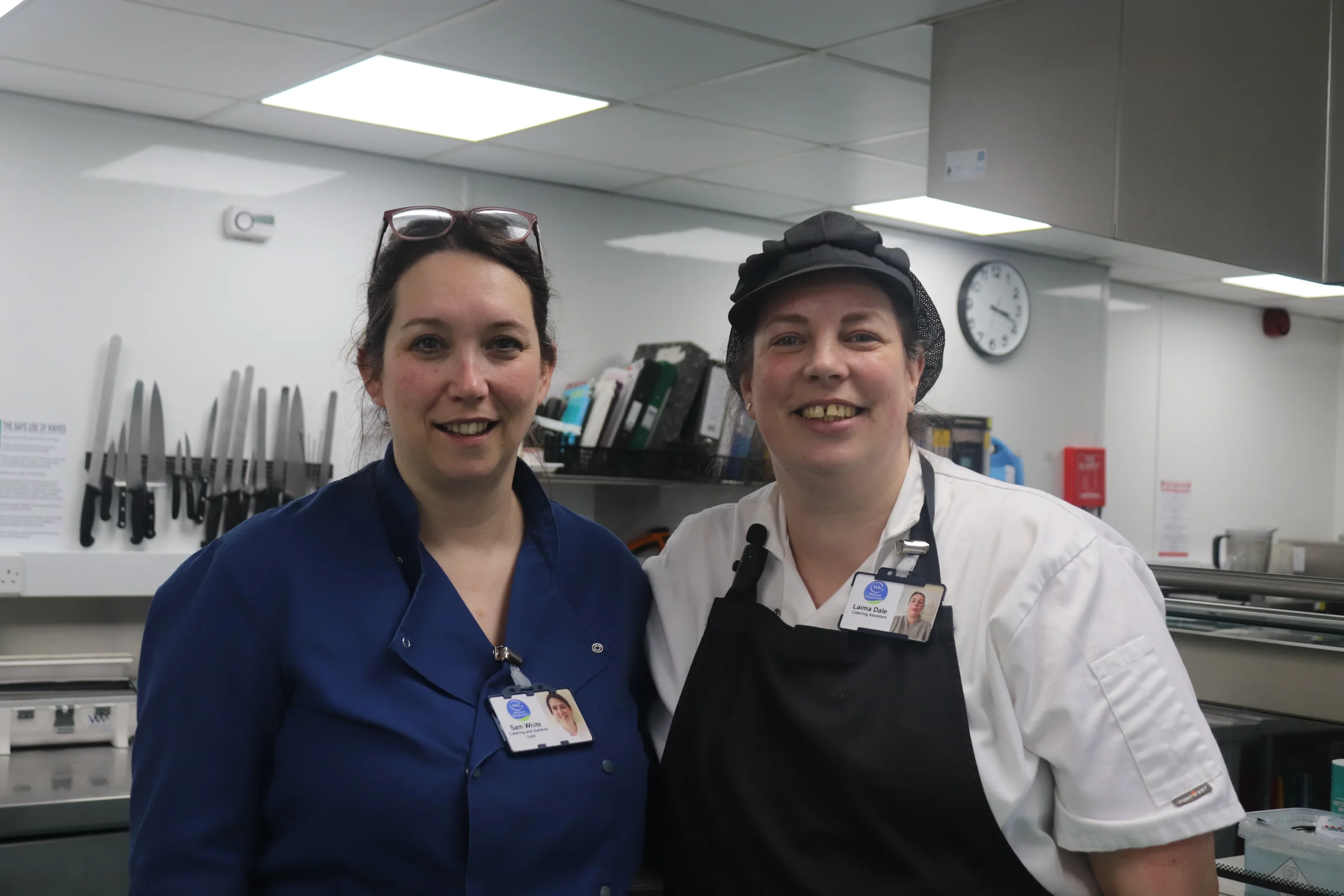 Sam, Catering and Nutrition Lead, and Liama, Chef, in the kitchen at Weldmar Hospicecare.